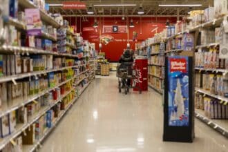 Shopping cart in a supermarket grocery store aisle