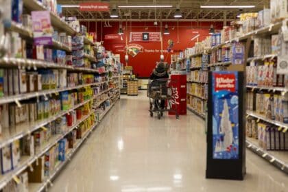 Shopping cart in a supermarket grocery store aisle
