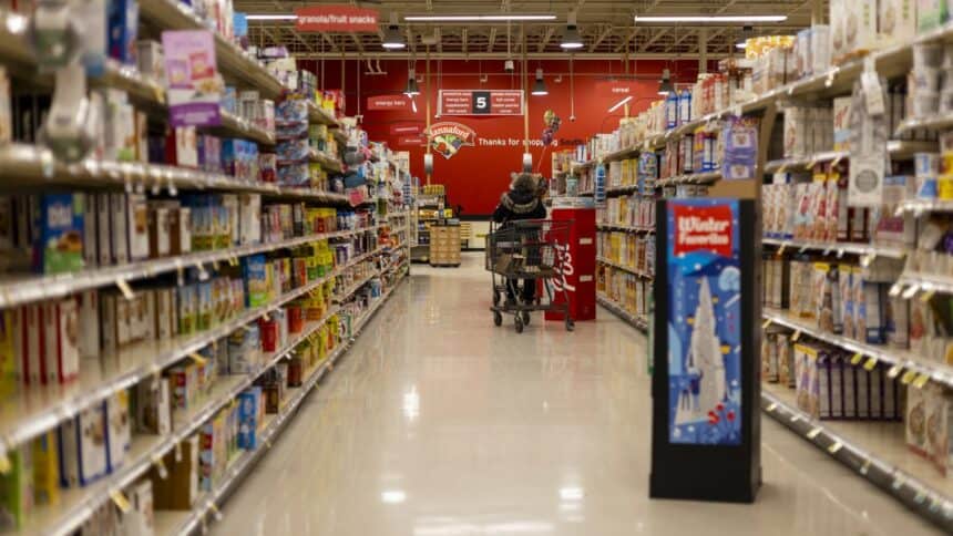 Shopping cart in a supermarket grocery store aisle