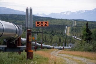 The Trans-Alaska Pipeline System traversing the Alaskan wilderness carrying domestic crude oil
