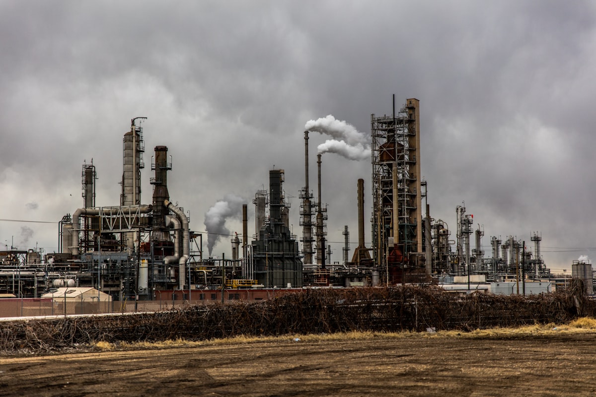 Industrial petroleum refinery and coastal fuel processing facility at sunset