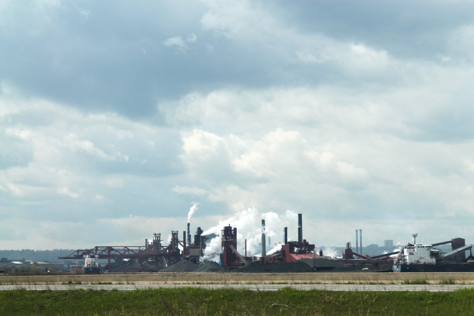 Exterior of a heavy industrial steel mill complex producing structural and marine plate steel