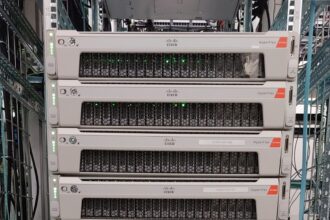 Enterprise data center server rack populated with high-performance computing nodes and fiber interconnects