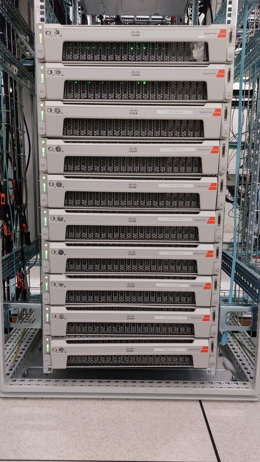 Enterprise data center server rack populated with high-performance computing nodes and fiber interconnects