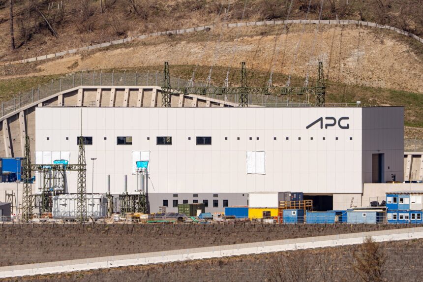 High-voltage electrical transformers, insulators, and transmission lines at a bulk-power grid substation