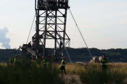 Large-scale mining excavator operating at an open-pit mineral excavation facility