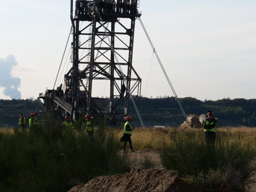 Large-scale mining excavator operating at an open-pit mineral excavation facility