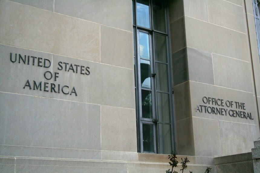 Exterior signage and stonework of the Robert F. Kennedy Department of Justice Building in Washington, D.C.