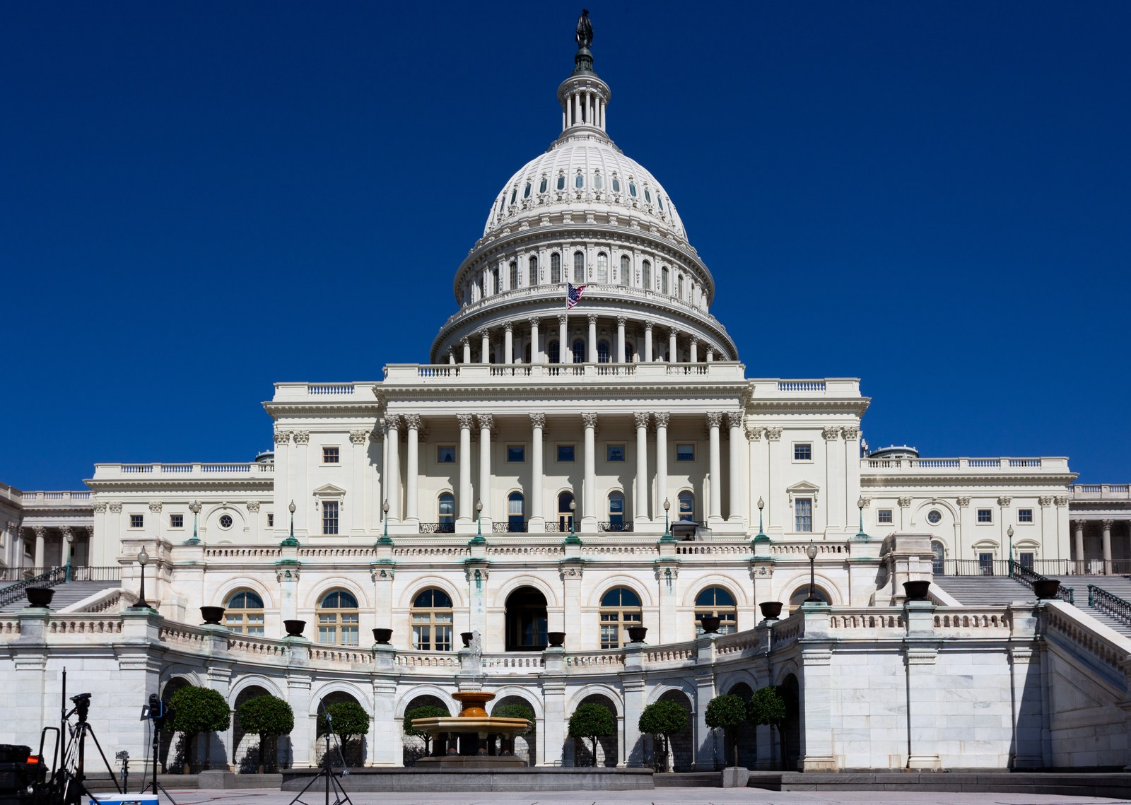 Full view of the United States Capitol building under blue skies in Washington D.C.
