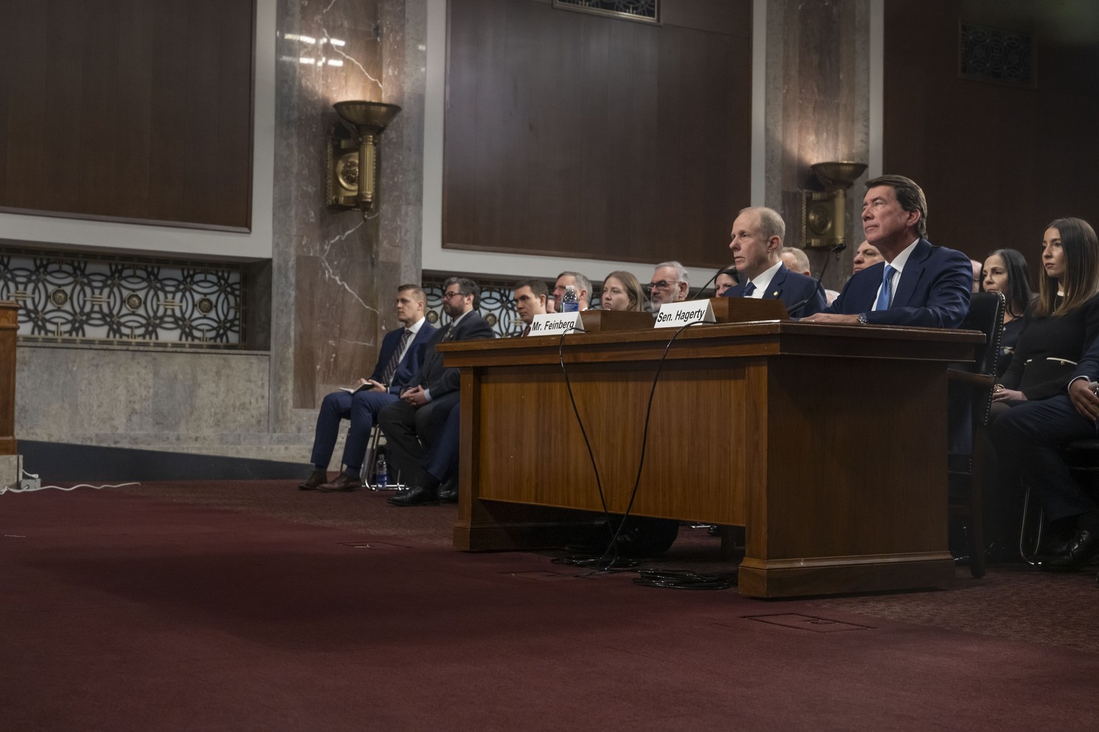 Senators seated at the dais during a formal committee hearing in the United States Senate